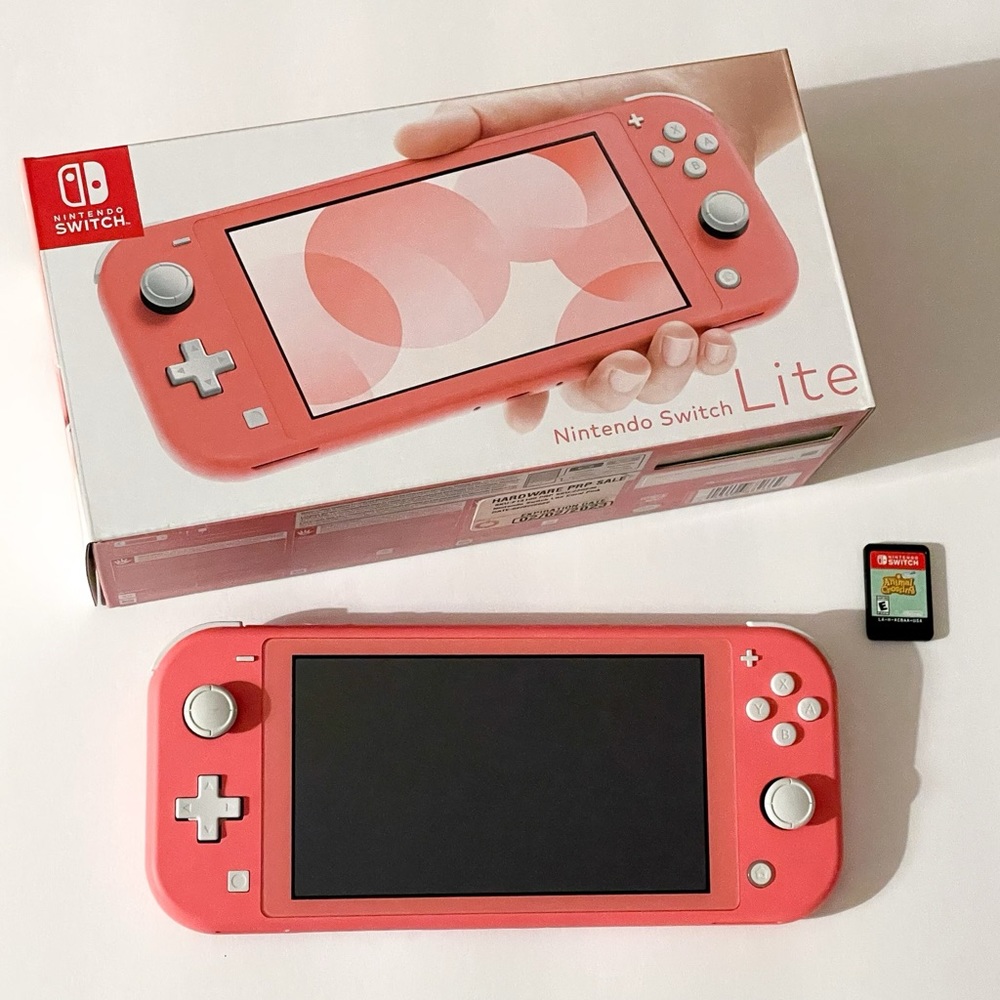 Nintendo switch lite, coral, with animal crossing game